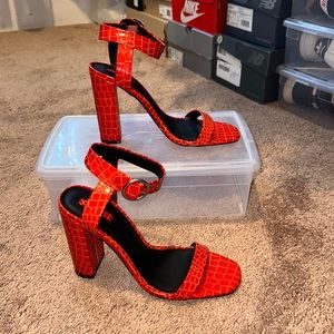 Red snake print heels